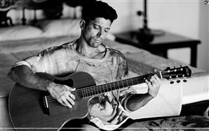 Farhan Akhtar poses with a guitaar